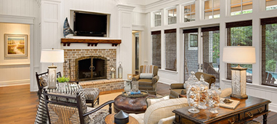 Livingroom with windows, tv and fireplace.